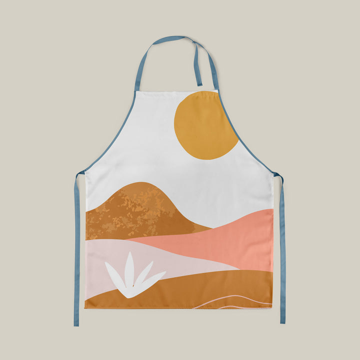 Kitchen apron with pastel coloured landscape print on beige background