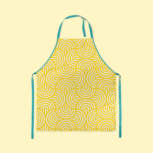 Geometric design in vibrant yellow ink screen printed on to apron with contrasting neck and waist ties