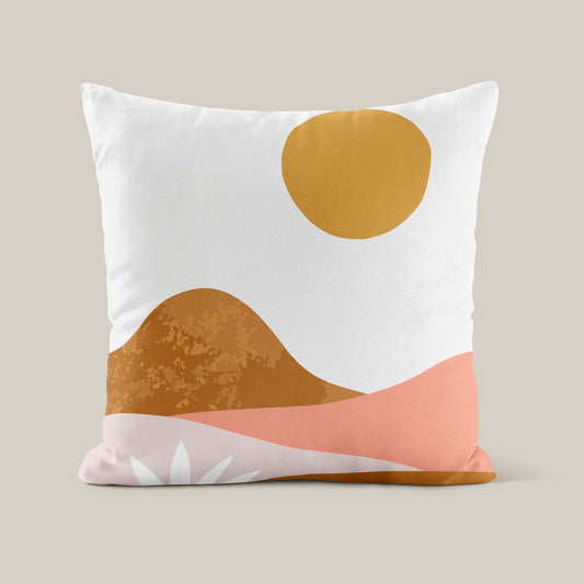 A cushion with a desert vista print