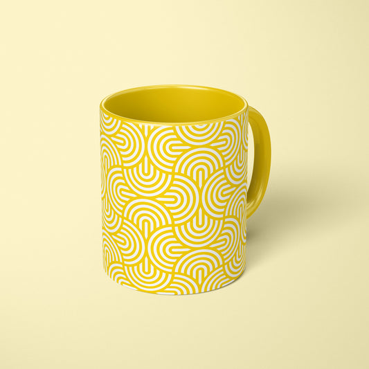 Yellow mug with geometric pattern on yellow background