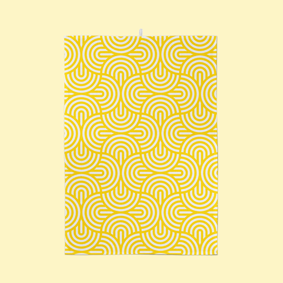 Yellow geometric tea towel on yellow background