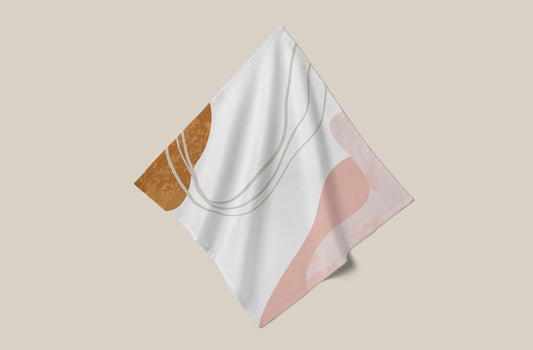 Tea towel with pastel coloured design print on beige background