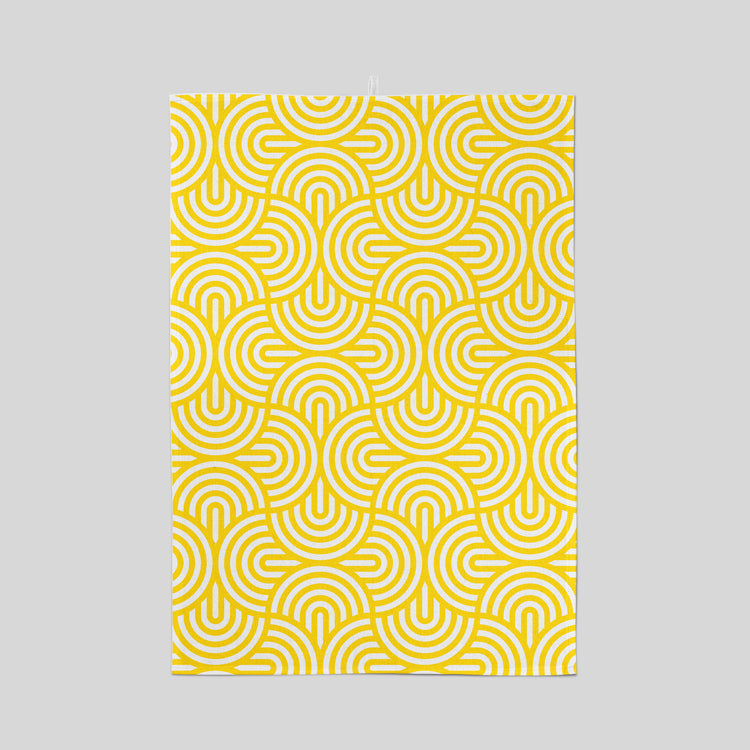 Screen printed tea towel with bright yellow geometric pattern